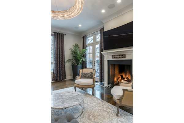 A living room with a fireplace and a couch.